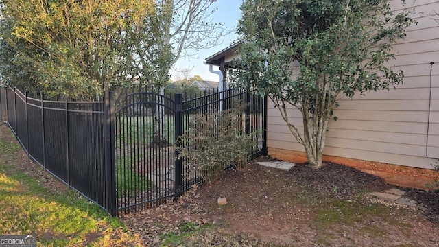 view of gate with fence