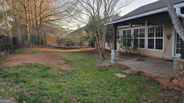 view of yard featuring a patio and fence