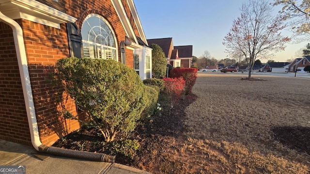 view of home's exterior with brick siding