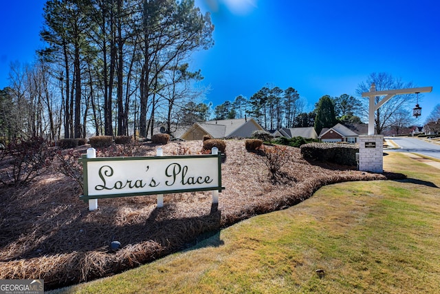 community sign with a lawn