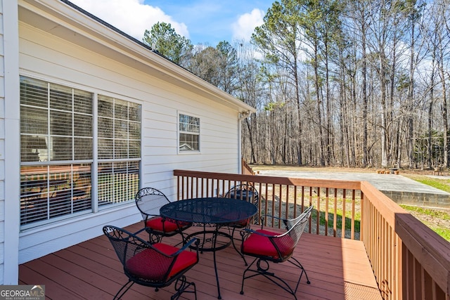 deck with outdoor dining area