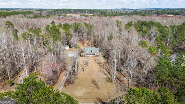 bird's eye view featuring a forest view