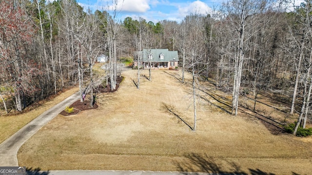 bird's eye view featuring a forest view