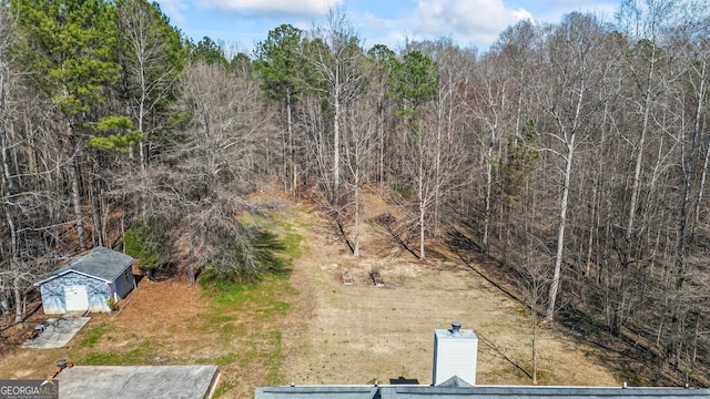 aerial view featuring a forest view