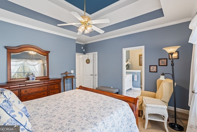 carpeted bedroom with a tray ceiling, baseboards, ceiling fan, and crown molding