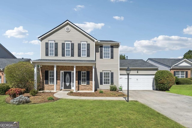 view of front of property with a front yard, a garage, brick siding, and concrete driveway