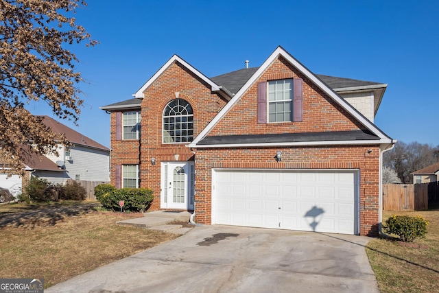 view of front of house with a garage, brick siding, driveway, and fence