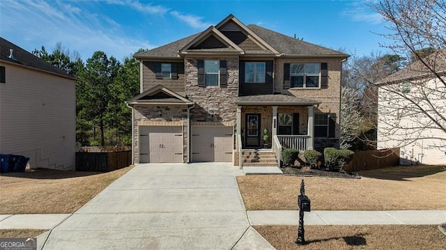 craftsman-style home with stone siding, covered porch, an attached garage, and concrete driveway