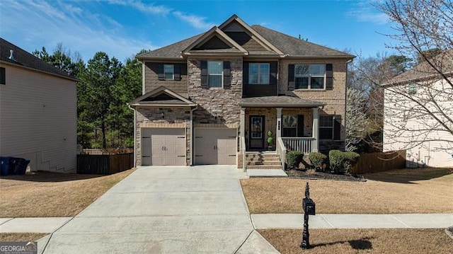 784 Sunset Down Ct, Loganville, GA 30052 - craftsman inspired home with concrete driveway, a garage, covered porch, and stone siding