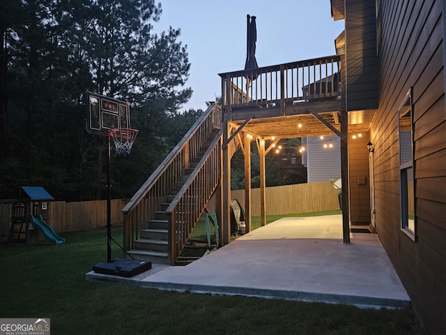 784 Sunset Down Ct, Loganville, GA 30052 - fenced backyard featuring a patio, stairway, a deck, and a playground