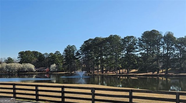 view of water feature with fence