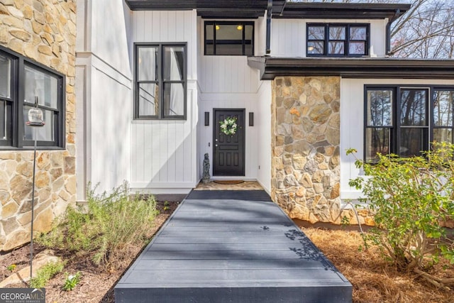 entrance to property with stone siding