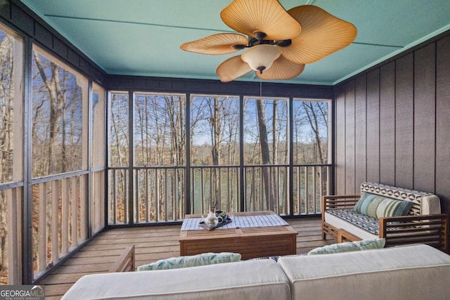 sunroom with a ceiling fan