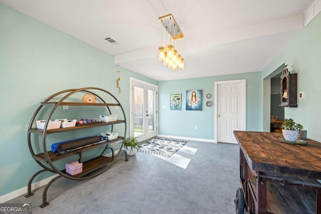 entrance foyer featuring visible vents, french doors, concrete floors, and baseboards