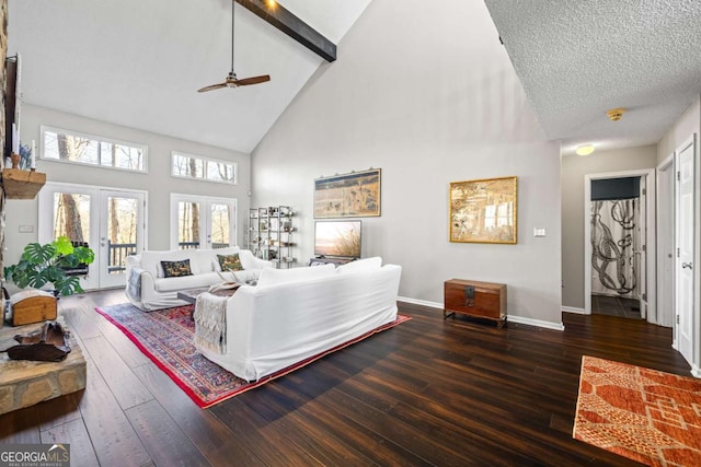 living area featuring baseboards, high vaulted ceiling, hardwood / wood-style floors, french doors, and a textured ceiling