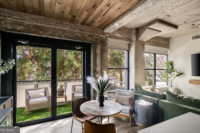 sunroom featuring wood ceiling and visible vents