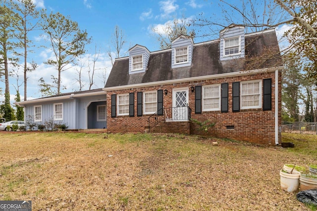 view of front facade featuring a front yard, fence, roof with shingles, crawl space, and brick siding