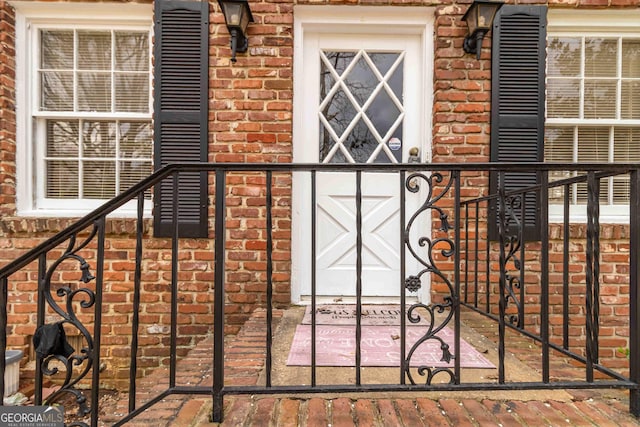 exterior space with brick siding