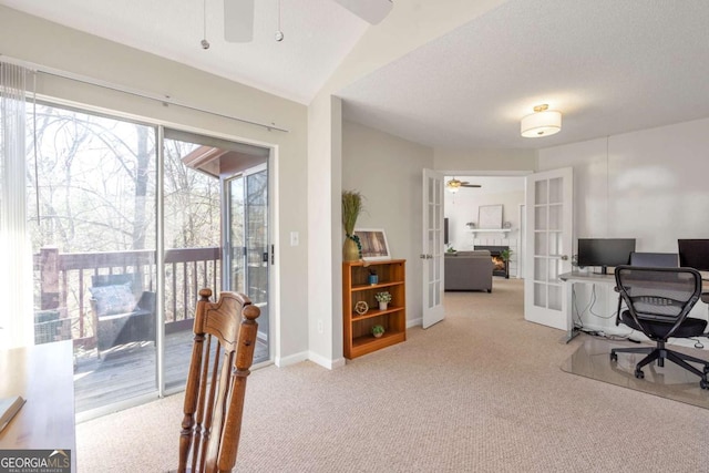 carpeted office space with french doors, baseboards, and a ceiling fan