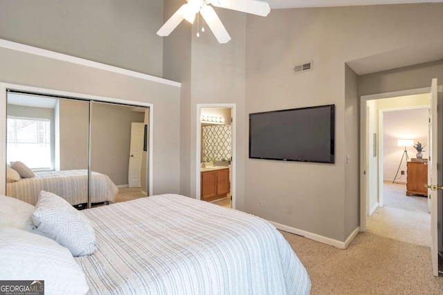 bedroom with a ceiling fan, baseboards, visible vents, a closet, and light carpet