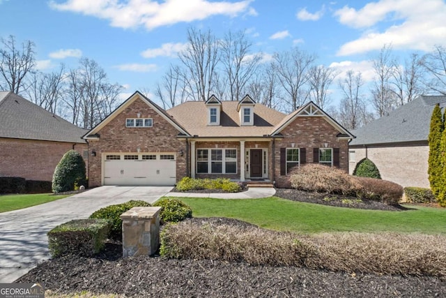 craftsman inspired home featuring brick siding, concrete driveway, and a front yard