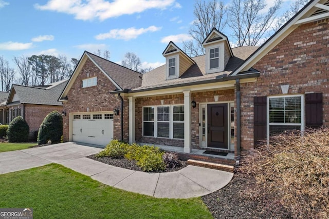 view of front facade with brick siding, driveway, a shingled roof, and a garage