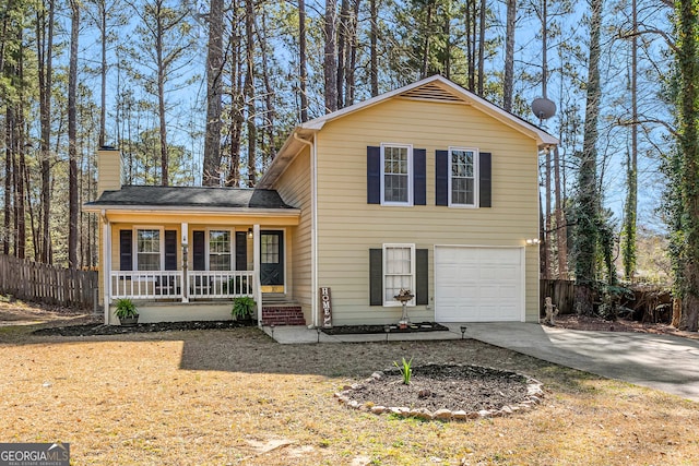 view of front of house with a porch, fence, concrete driveway, a garage, and a chimney