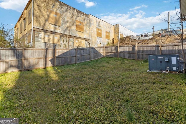 view of yard with a fenced backyard