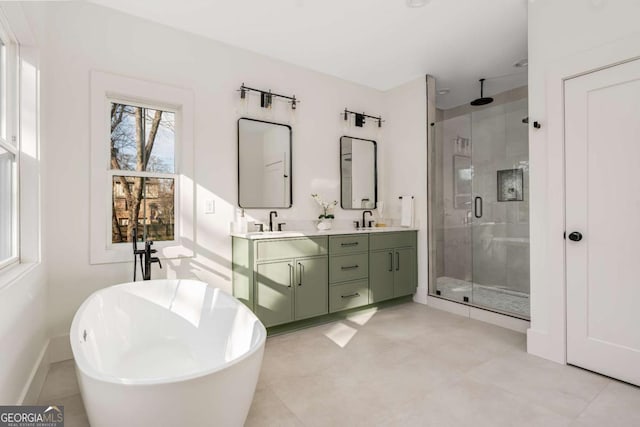 1103 Boulevard Dr SE, Atlanta, GA 30317 - full bath featuring a sink, a freestanding bath, a stall shower, and double vanity