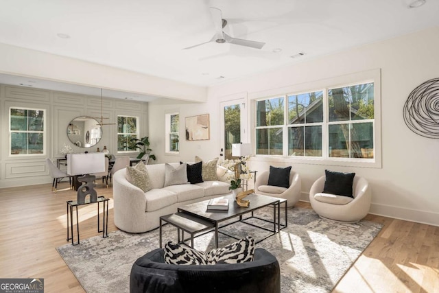 1103 Boulevard Dr SE, Atlanta, GA 30317 - living room featuring visible vents, baseboards, wood finished floors, and a ceiling fan