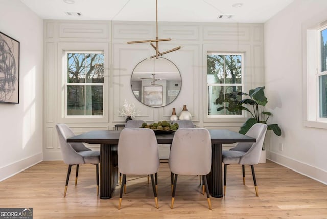 1103 Boulevard Dr SE, Atlanta, GA 30317 - dining room with baseboards, visible vents, and light wood-type flooring