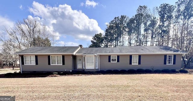 ranch-style home featuring a front yard