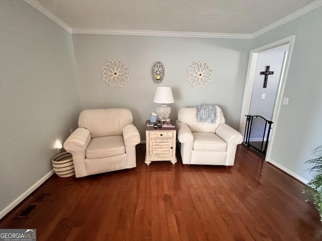 living area featuring dark wood-type flooring, baseboards, and ornamental molding