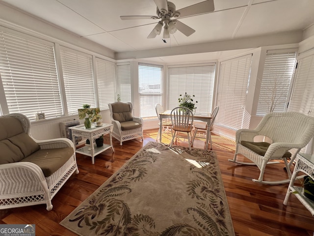 living room featuring a wealth of natural light, ceiling fan, and wood finished floors