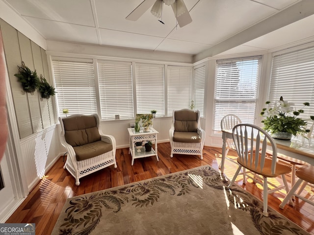 sunroom featuring ceiling fan