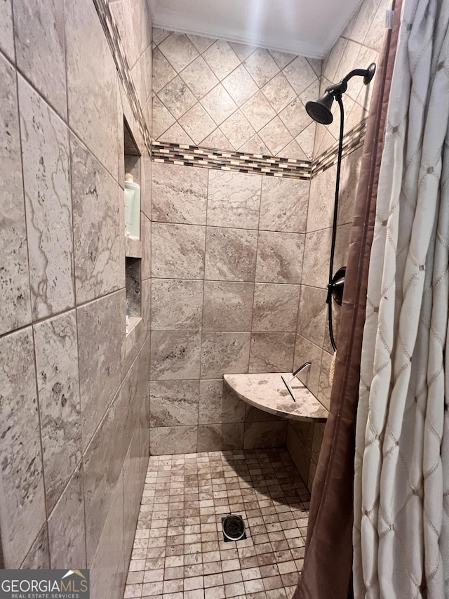 full bath with a tile shower