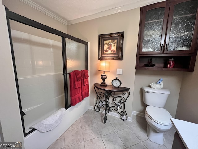 bathroom featuring crown molding, baseboards, toilet, shower / bath combination with glass door, and tile patterned floors