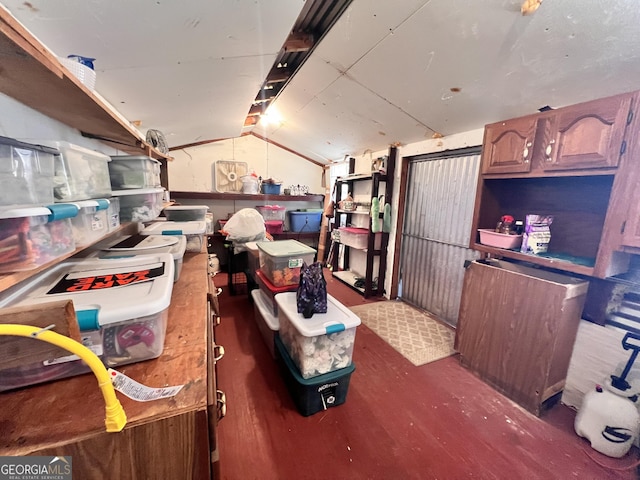 kitchen featuring open shelves and vaulted ceiling