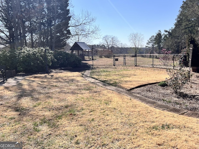 view of yard featuring a gate and fence