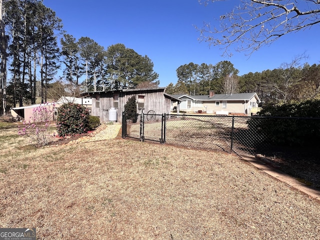 view of yard featuring a gate and fence