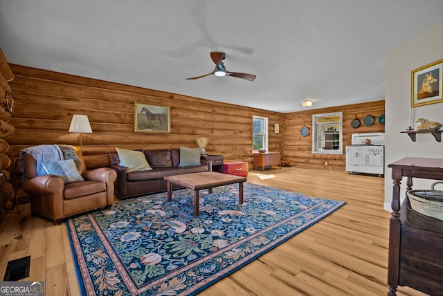 living area featuring ceiling fan and wood finished floors