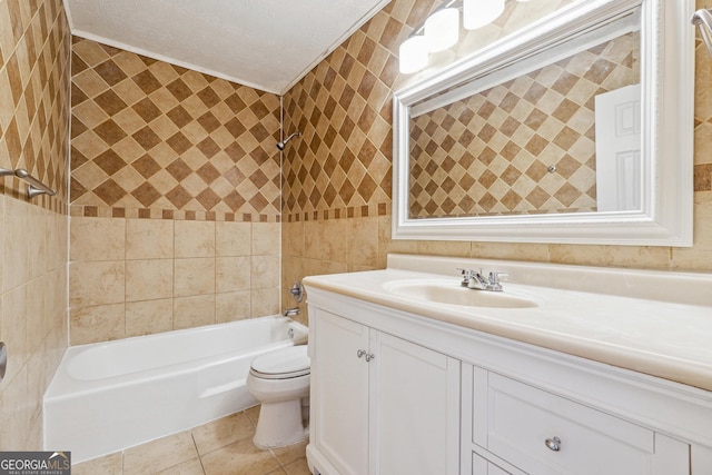 bathroom with tile patterned flooring, toilet, shower / bathing tub combination, a textured ceiling, and vanity