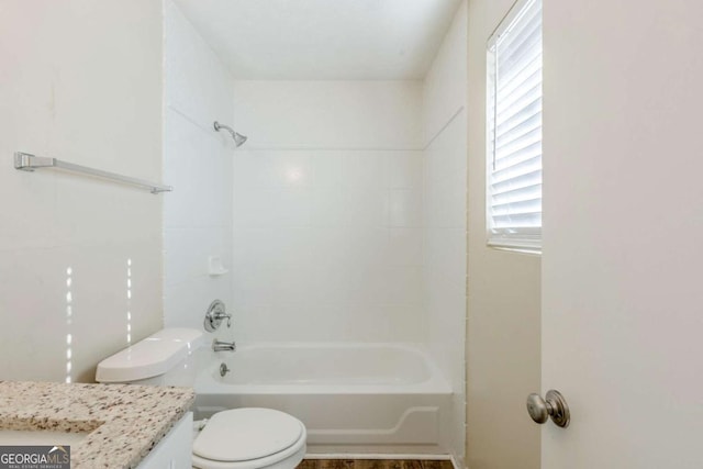 full bathroom featuring bathing tub / shower combination, toilet, and vanity