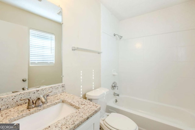 full bath with vanity,  shower combination, and toilet