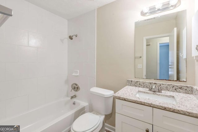 bathroom featuring bathing tub / shower combination, toilet, and vanity