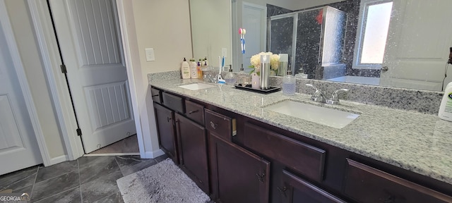 full bathroom with a sink, a garden tub, double vanity, and a shower stall