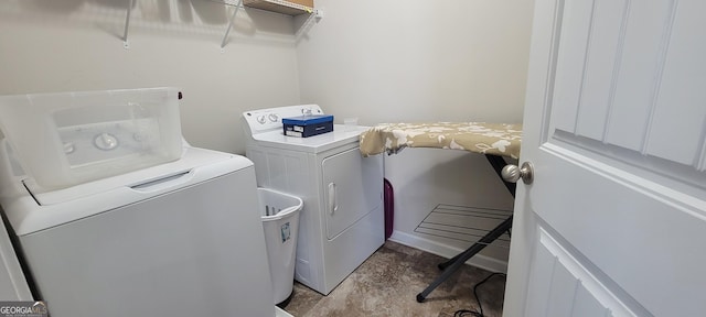 clothes washing area with washer and dryer and laundry area