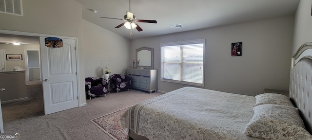 bedroom featuring vaulted ceiling, carpet, visible vents, and ceiling fan