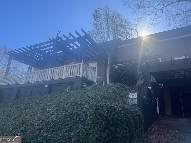 view of property exterior featuring a pergola