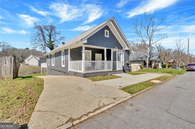 view of front of home featuring covered porch and concrete driveway